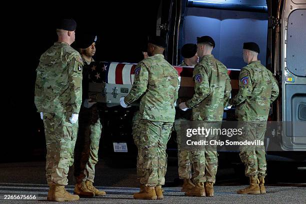 Army carry team moves a flag-draped transfer case containing the remains of Army Sgt. Benjamin N. Pennington at Dover Air Force Base on March 9, 2026...