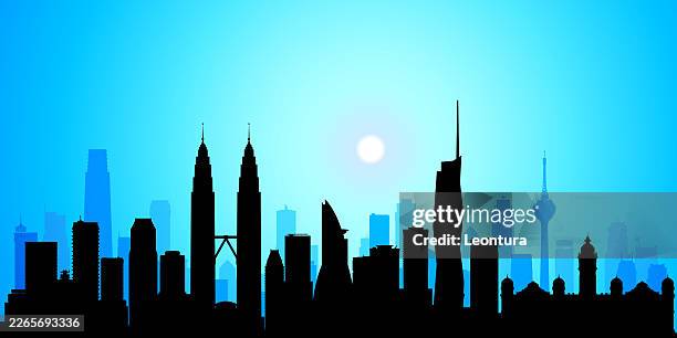 kuala lumpur skyline silhouette at night - kuala lumpur convention centre stock illustrations