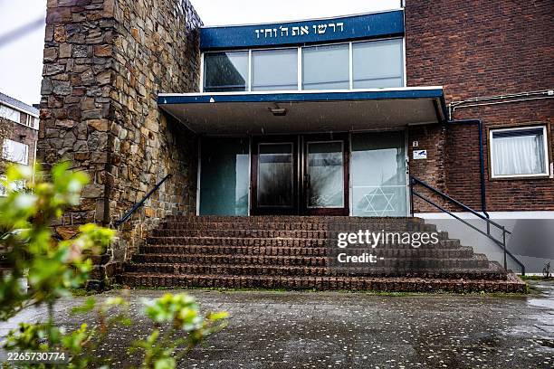 This photograph shows a synagogue on ABN Davidsplein in Rotterdam, western Netherlands on March 13, 2026 after a fire started. The Rotterdam police...