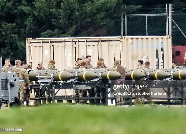 Airforce personnel work with munitions at RAF Fairford on March 10, 2026 in Fairford, England. Prime Minister Keir Starmer is allowing the US to use...