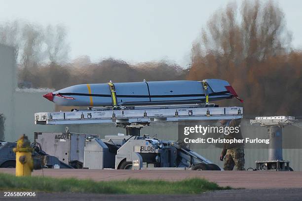 Munitions are handled by U.S. Ground crew at RAF Fairford on March 13, 2026 in Fairford, England. Prime Minister Keir Starmer is allowing the US to...