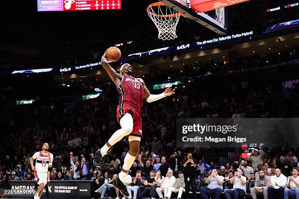 Bam Adebayo of the Miami Heat dunks the ball against the Washington Wizards during the third quarter of the game at Kaseya Center on March 10, 2026...