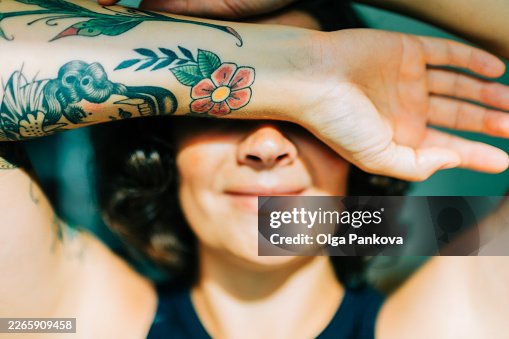 Woman shielding eyes from sun feeling happy Woman shielding eyes from sun feeling happy