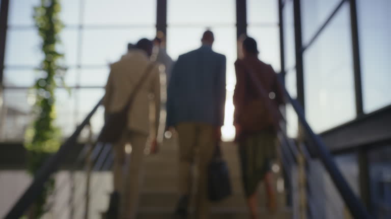 https://media.gettyimages.com/id/2265912578/video/sunrise-walking-and-business-people-on-staircase-in-office-building-commute-and-start-of.jpg?b=1&s=640x640&k=20&c=XfropFB1e_czMkb1U_HxDsUEpKOY6rTU6WUOyha5xFA=