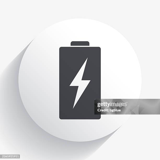 battery charging. icon on circle button with long shadow - lithium stock illustrations