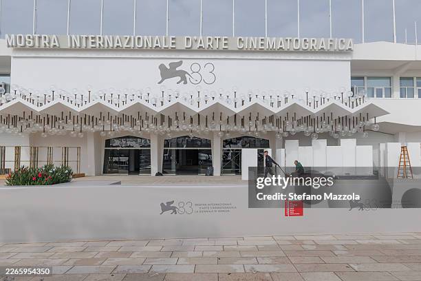 Workers walk at the Venice Film Festival on the Lido on 11 March 2026 in Venice, Italy. The second season of the TV series 'The Studio', a comedy...