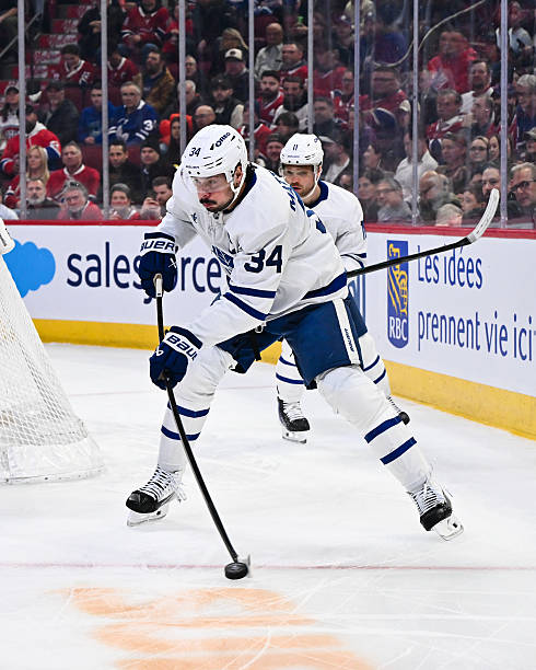 Auston Matthews of the Toronto Maple Leafs handles the puck during the first period against the Montréal Canadiens at the Bell Centre on March 10,...