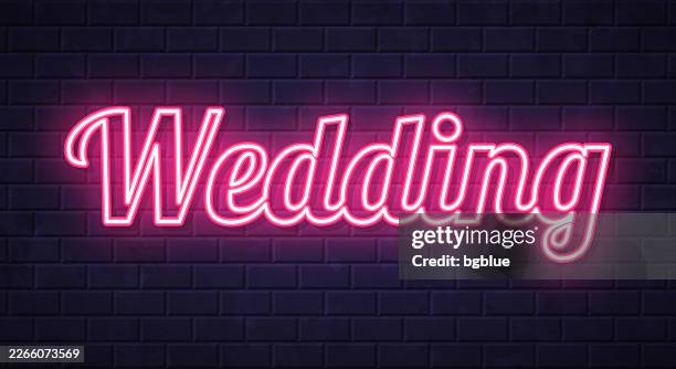 wedding - glowing neon text on brick wall background - simple wedding background stock illustrations