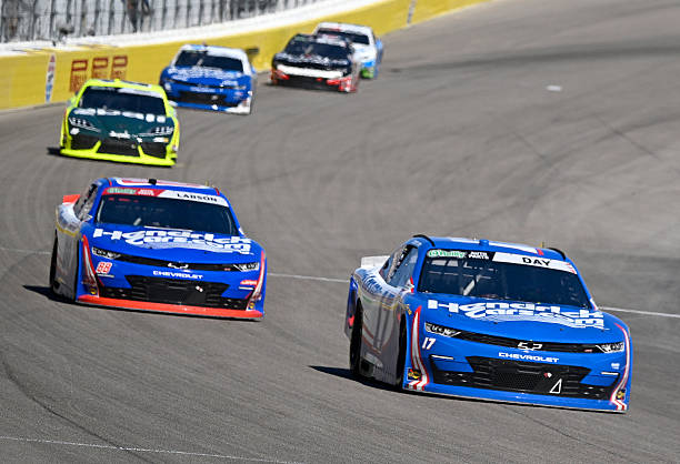 Teammates Corey Day and Kyle Larson race for postion during the early laps of the NASCAR O'Reilly Auto Parts Series The LiUNA on March 14 at Las...