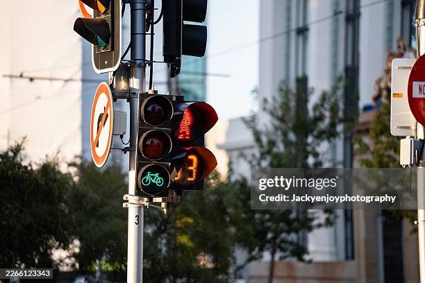 sidewalk crossing light and green and red traffic light - road signal stock pictures, royalty-free photos & images