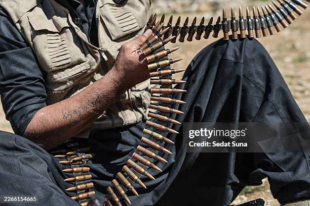 Member of Komala of the Toilers of Kurdistan, a Kurdish Iranian dissident group, arranging the bullets at their military bases hidden among the...
