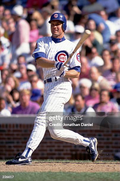 Second Baseman Ryne Sandberg of the Chicago Cubs makes contact with a pitch during a game against the San Francisco Giants at Wrigley Field on May...