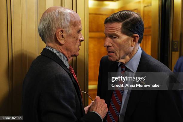 Sen. Peter Welch and Sen. Richard Blumenthal speak to one another outside of the Senate Chambers during a vote at the U.S. Capitol Building on March...