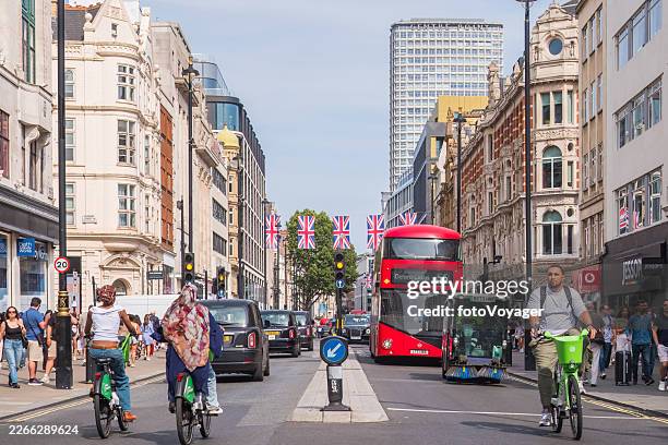 london oxford street retail stores crowds shoppers red bus taxis - lime stock pictures, royalty-free photos & images