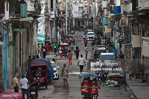 View of a street of Havana during a blackout on March 16, 2026. Cuba suffered a widespread power cut on March 16 according to the national...