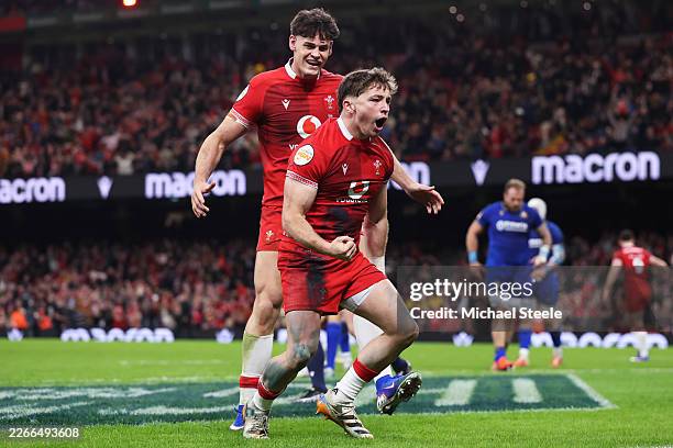 Dan Edwards of Wales celebrates scoring his team's fourth try with teammate Eddie James during the Guinness Six Nations 2026 match between Wales and...