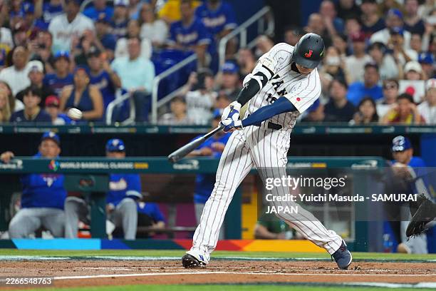 Shohei Ohtani of Team Japan hits a solo home run in the first inning during the 2026 World Baseball Classic quarterfinal between Venezuela and Japan...