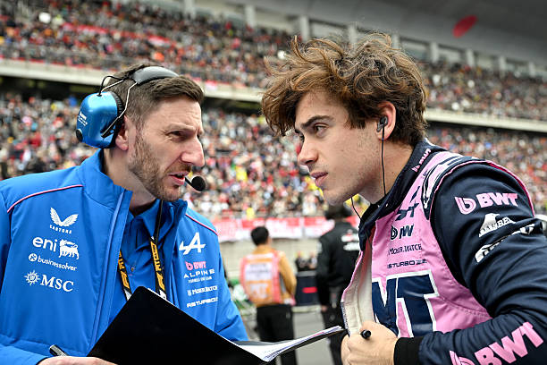 Franco Colapinto of Argentina and Alpine F1 talks with an engineer on the grid prior to the F1 Grand Prix of China at Shanghai International Circuit...