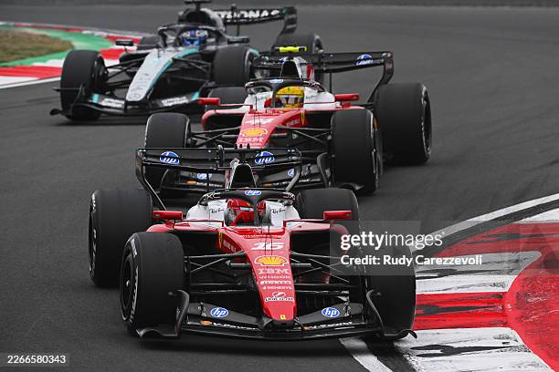 Charles Leclerc of Monaco driving the Scuderia Ferrari SF-26 leads Lewis Hamilton of Great Britain driving the Scuderia Ferrari SF-26 on track during...