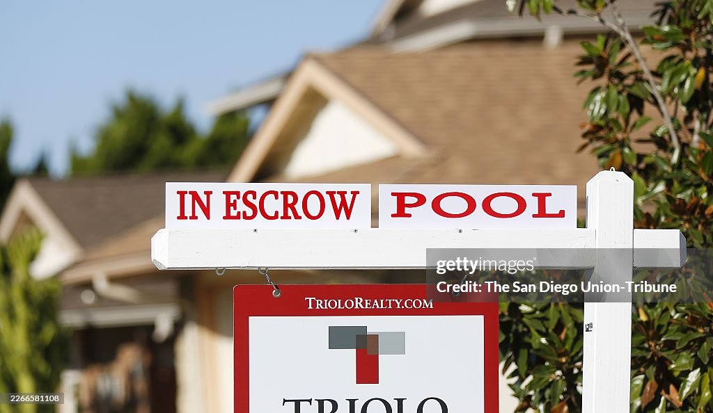 SAN DIEGO, CA - OCTOBER 27: An In Escrow sign is displayed outside of a Clairemont home on Tuesday, Oct. 27, 2020 San Diego, CA. San Diego home prices went up the third-fastest in the nation in August and appreciated at a pace not seen in more than two ye