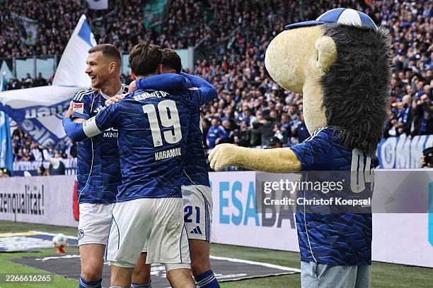 Edin Dzeko of FC Schalke 04 celebrates the first goal with his team mates during the 2. Bundesliga match between FC Schalke 04 and Hannover 96 at...