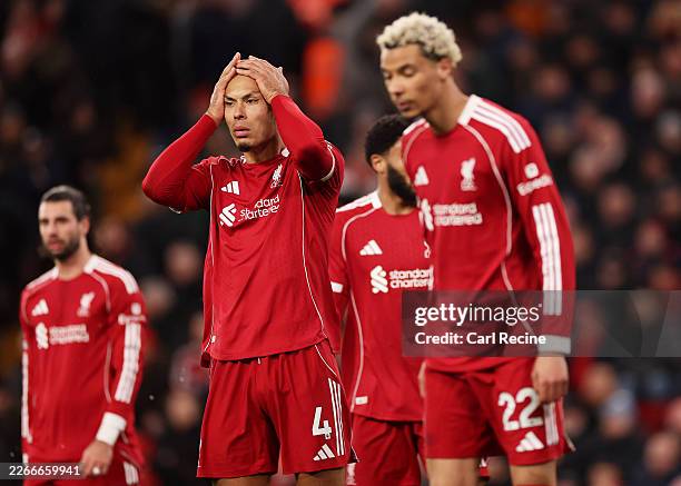 Virgil van Dijk of Liverpool looks dejected following the Premier League match between Liverpool and Tottenham Hotspur at Anfield on March 15, 2026...