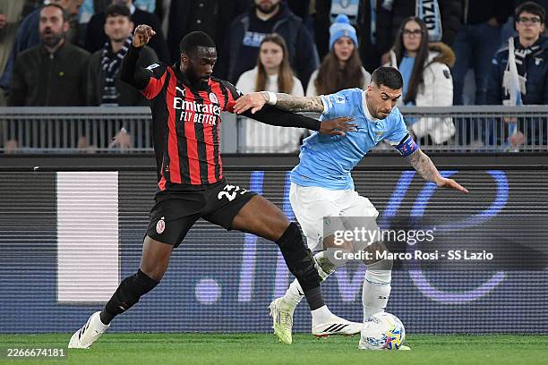 Mattia Zaccagni of SS Lazio competes for the ball with Fikayo Tomori of AC MIlan during the Serie A match between SS Lazio and AC Milan at Stadio...