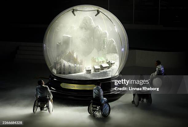 The skyline of Milan, the Duomo, and the Dolomites are presented in a giant snow globe during the Milano Cortina 2026 Winter Paralympic Games closing...