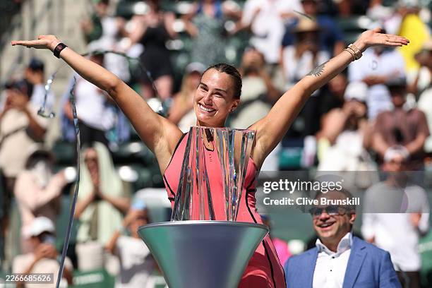 Aryna Sabalenka poses with the championship trophy after defeating Elena Rybakina of Kazakhstan during their Women's Singles Finals match on Day 12...
