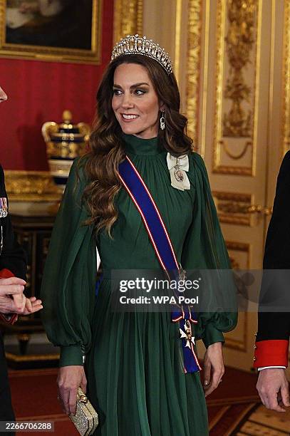 Catherine, Princess of Wales arrives to attend a State Banquet in St George's Hall on day one of their state visit to the UK at Windsor Castle on...