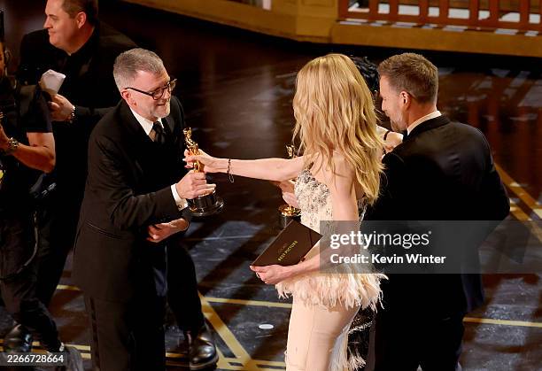 Paul Thomas Anderson accepts the Best Picture award for "One Battle After Another" from Nicole Kidman and Ewan McGregoronstage during the 98th Oscars...