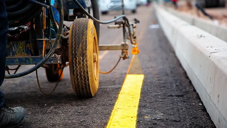 https://media.gettyimages.com/id/2266829410/video/close-up-of-road-marking-machine-applying-yellow-line-on-asphalt.jpg?b=1&s=640x640&k=20&c=bOkuapGO_40GKBEokjLLiM5Twy8BBvgQ5blRZbyZvTw=