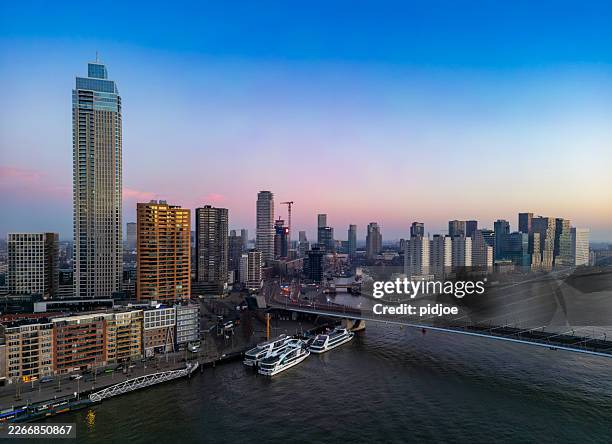 rotterdam skyline view over the new maas at dawn. - rotterdam stock pictures, royalty-free photos & images