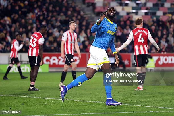 Tolu Arokodare of Wolverhampton Wanderers celebrates scoring his team's second goal during the Premier League match between Brentford and...