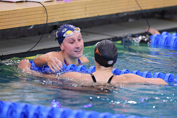 Anna Moesch of Virginia hugs Nikolett Padar of Texas following the 200 yard freestyle during the Division I Women's Swimming and Diving Championship...