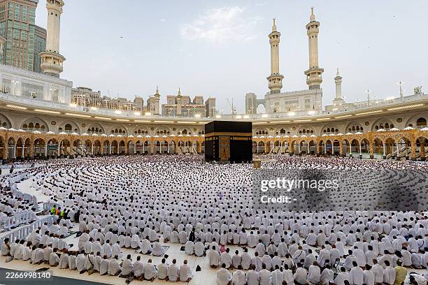 Muslim worshippers gather around the Kaaba, Islam's holiest shrine, at the Grand Mosque complex in Saudi Arabia's holy city of Mecca on March 20,...