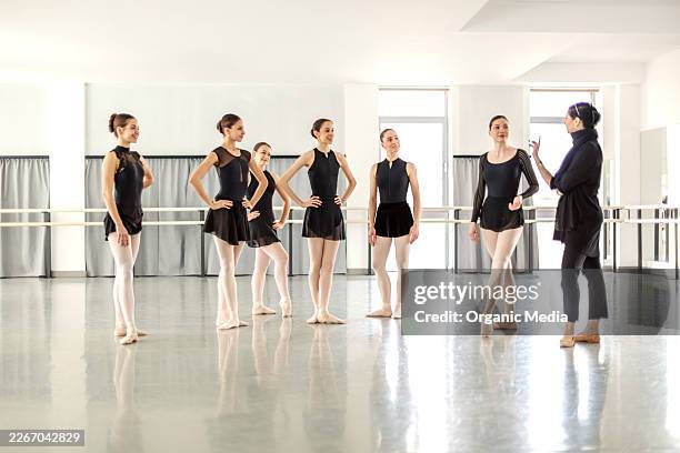 ballet instructor teaching aspiring dancers in studio - dance practice stock pictures, royalty-free photos & images