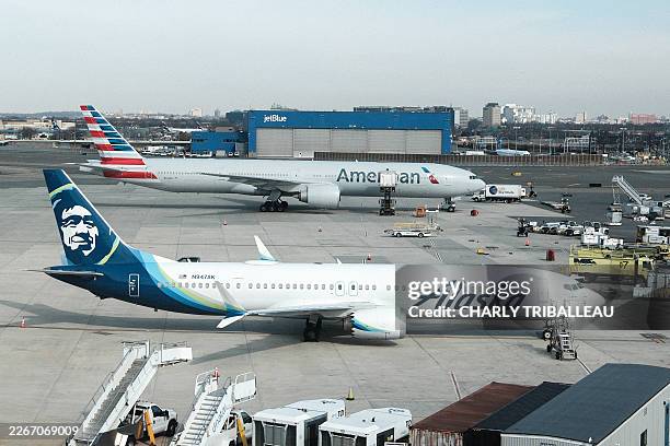 Boeing 737 MAX 9 passenger aircraft of Alaska Airlines and Boeing 777-300ER passenger aircraft of American Airlines are pictured at John F. Kennedy...