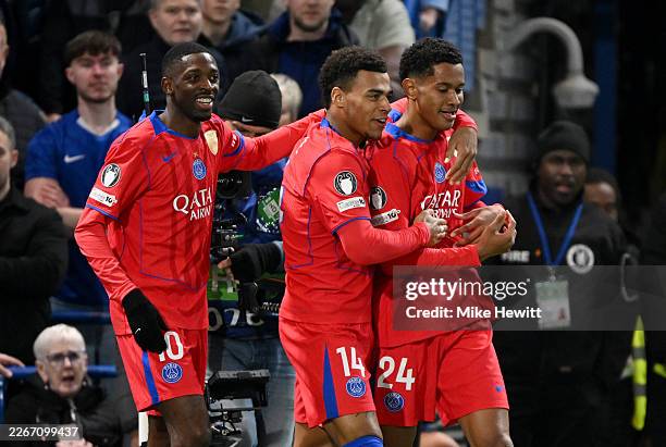 Senny Mayulu of Paris Saint-Germain celebrates scoring his team's third goal with teammates Ousmane Dembele and Desire Doue during the UEFA Champions...