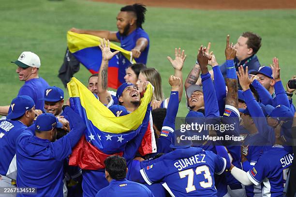 Members of Team Venezuela celebrate after the 3-2 victory against Team United States at loanDepot park on March 17, 2026 in Miami, Florida.