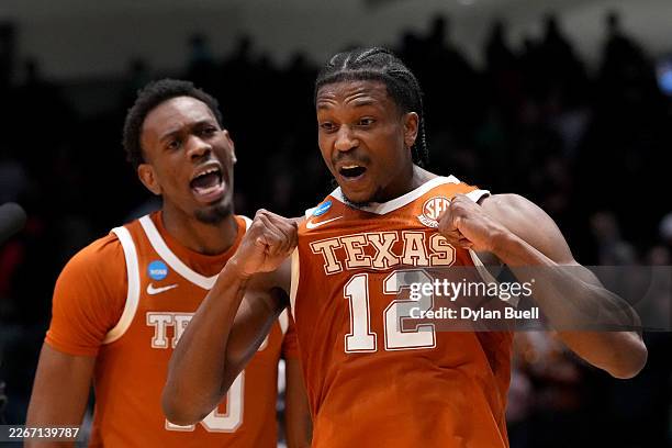 Tramon Mark of the Texas Longhorns celebrates with Nic Codie after making the game winning shot against NC State Wolfpack during the second half in...