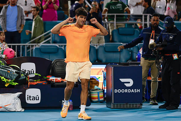 Carlos Alcaraz celebrates after his men's singles match against Joao Fonseca at the Miami Open on March 20 at Hard Rock Stadium in Miami Gardens,...