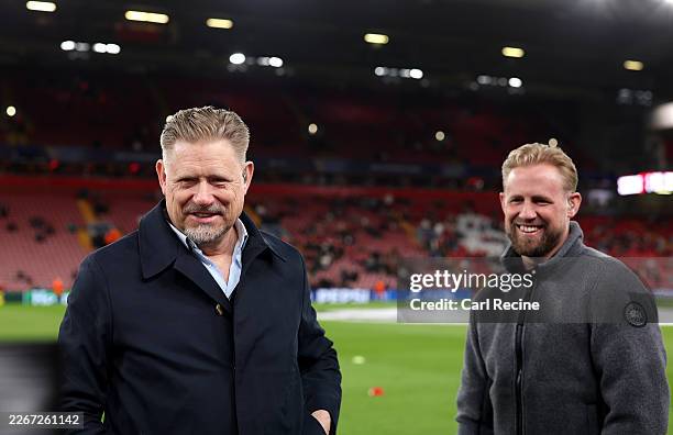 Pundit Peter Schmeichel and his son Kasper Schmeichel react prior to the UEFA Champions League 2025/26 Round of 16 Second Leg match between Liverpool...