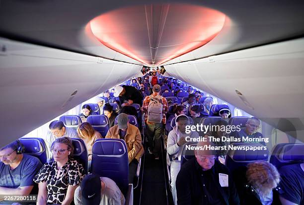 Southwest Airlines passengers settle in gfor an early nonstop flight to Seattle-Tacoma International Airport in Sea-Tac, Washington from Dallas Love...