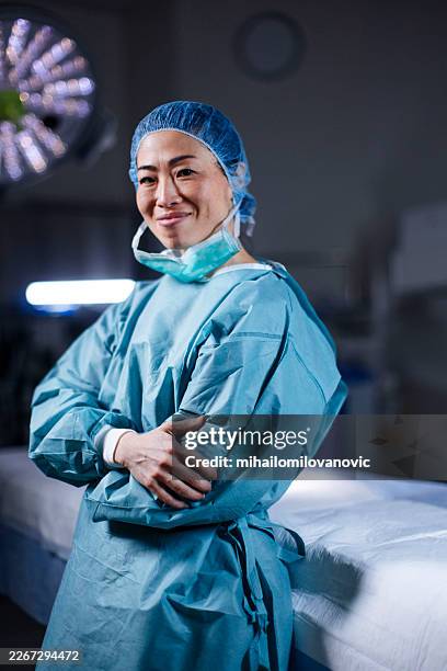 the face of clinical success - operating gown stock pictures, royalty-free photos & images