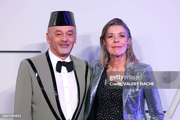 French fashion designer Christian Louboutin and Princess Caroline of Hanover, also known as Caroline de Monaco, pose upon arrival for the 70th...