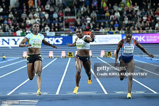 Italy's Zaynab Dosso wins ahead of Saint Lucia's Julien Alfred and Britain's Dina Asher-Smith in the women's 60m final during the World Athletics...