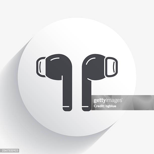 wireless earphones. icon on circle button with long shadow - wireless earbuds stock illustrations