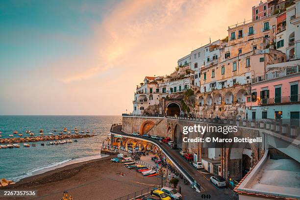 the cliffside village of atrani at sunset along the amalfi coast, campania, southern italy. - coastline stock pictures, royalty-free photos & images