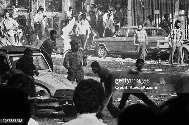 Clashes between revolutionary forces and supporters of the daily newspaper 'Ayandagan' during a demonstration for press freedom in Tehran, Iran, 1979.
